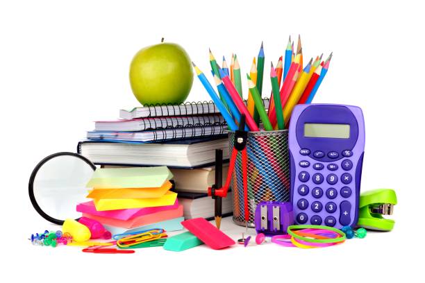 Books and school supplies isolated on white