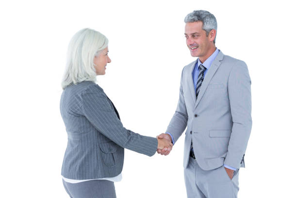 istock Businessman shaking hands with a businesswoman 809281116