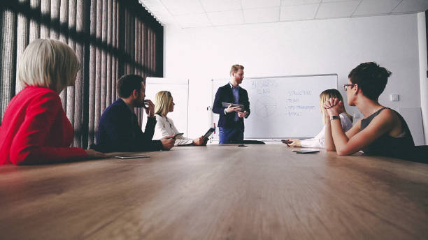 istock Business man presenting new ideas and projects to his team 809289362