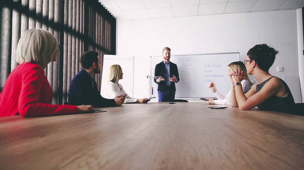 istock Business man presenting new ideas and projects to his team 809289440