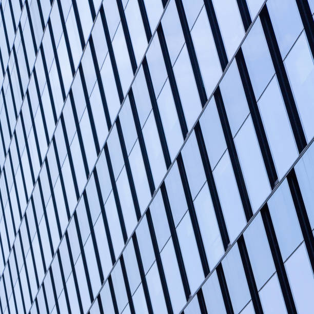 istock Modern office architectur at blue glass wall backgrounds 809297504