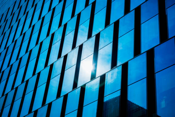 istock Modern office architectur at blue glass wall backgrounds 809308090