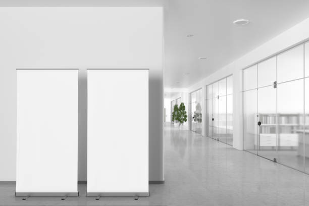 istock Blank roll up banner stand in modern office interior 809308642