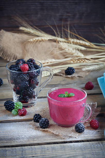 istock Delicious blackberry and raspberry smoothie, detox yogurt or milkshake with fresh berries. 809376052
