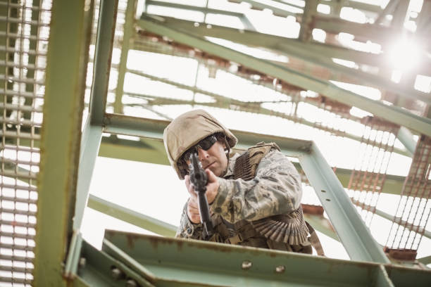 istock Military soldier guarding with a rifle 809399844