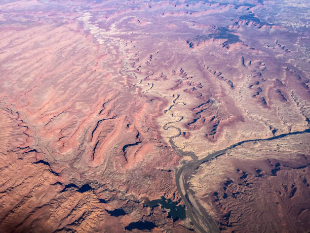 istock View from the plane window when flying over mountain range, canyons and valleys 809476056