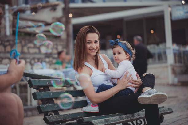 istock Mother holding her daughter 809487098