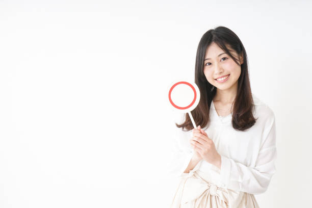 Young woman showing the circle sign