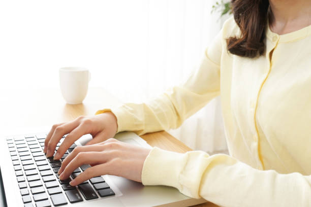 istock Young woman typing with laptop 809526288