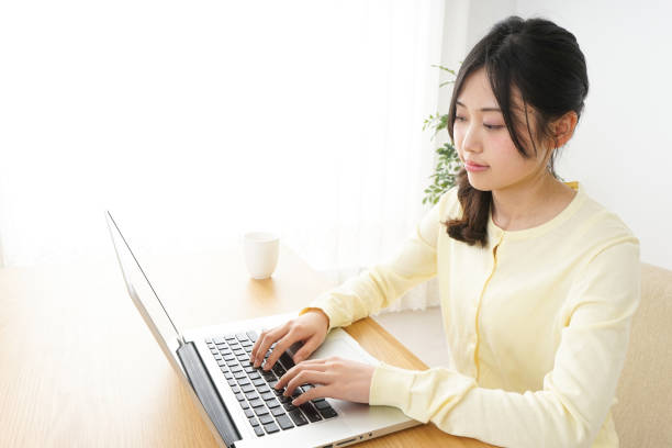 istock Young woman typing with laptop 809526414