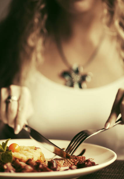 istock Woman dining at restaurant 809528250