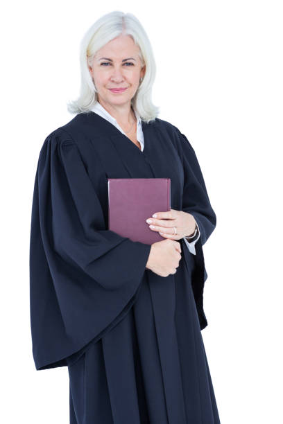 istock Happy lawyer looking at camera and holding law code 809528306