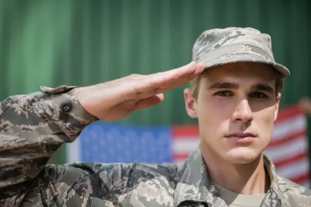Photo of Portrait of military soldier giving salute