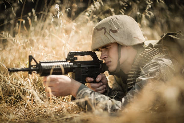 istock Military soldier aiming with a rifle 809611766