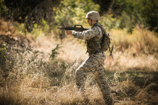 istock Military soldier aiming with a rifle 809612406