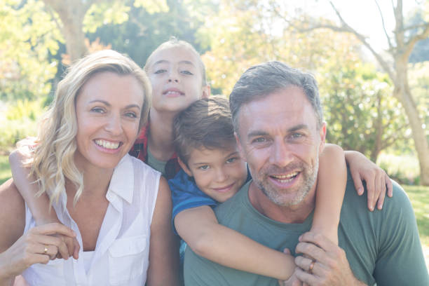 istock Happy family in park on a sunny day 809648122