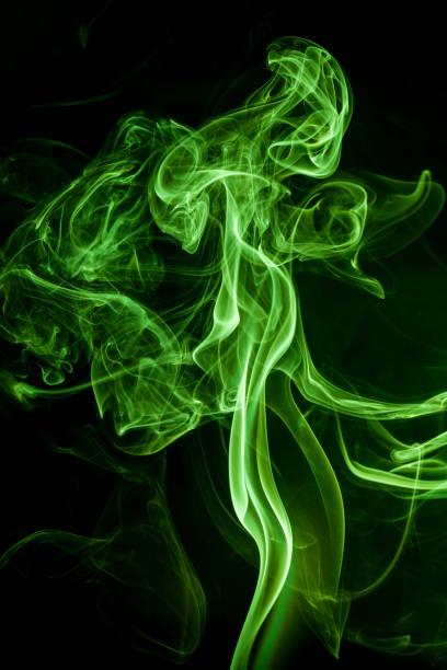 istock Green smoke movement on black background. 809682772