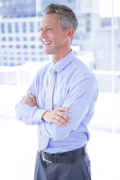 istock Smiling businessman in the office 809685394
