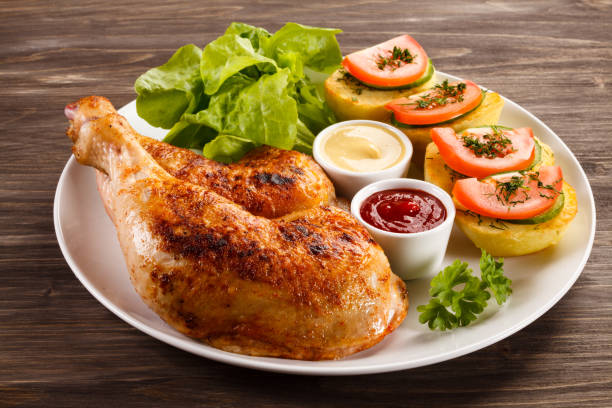 istock Roast chicken leg and vegetables 809692840