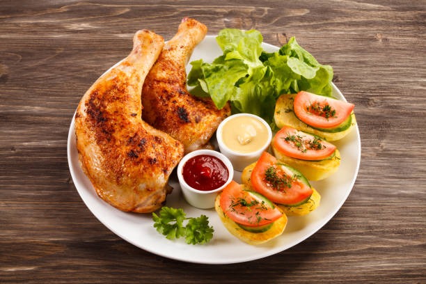 istock Roast chicken leg and vegetables 809693030