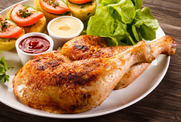 istock Roast chicken leg and vegetables 809693194