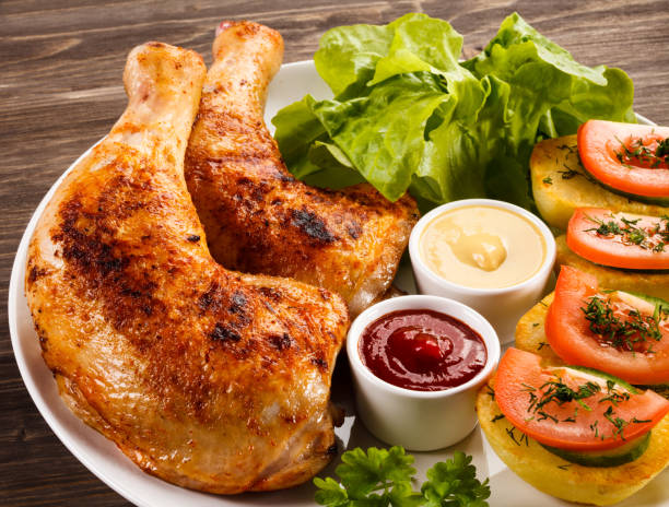 istock Roast chicken leg and vegetables 809693486