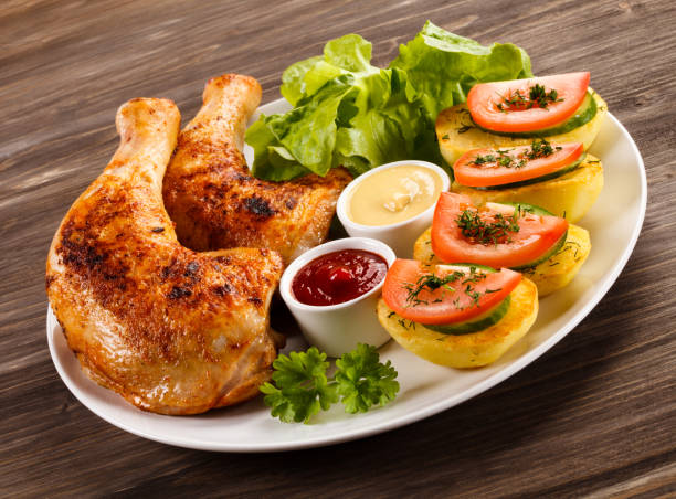 istock Roast chicken leg and vegetables 809693936
