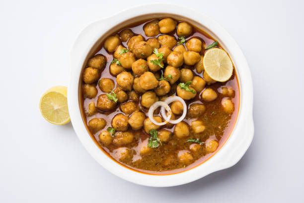 istock Chickpeas Masala - Chole masala curry ,traditional north indian lunch, dinner menu served in a ceramic bowl, selective focus 809702184