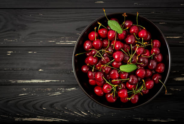 istock Ripe Sweet Cherry on a plate. Flat lay. Top view 809747824