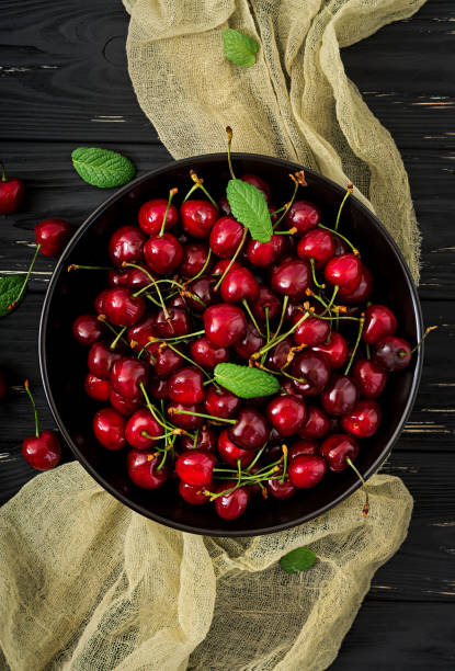 istock Ripe Sweet Cherry on a plate. Flat lay. Top view 809747834