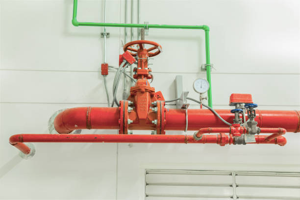 istock Industrial fire protection system with pressure gauge for measuring pressure, pipeline extinguishing water on the wall. 809761372