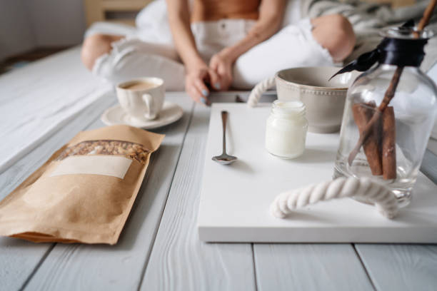 istock Woman eating cereals in bed 809785334