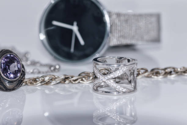 istock Silver ring and chain on the background of watches 809794782