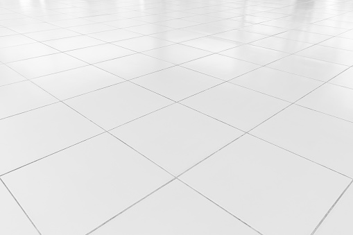 White tile floor clean condition with grid line for background.