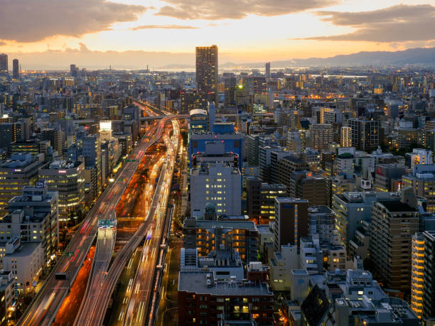 istock Osaka city highway and illuminated car trails and building 809811754