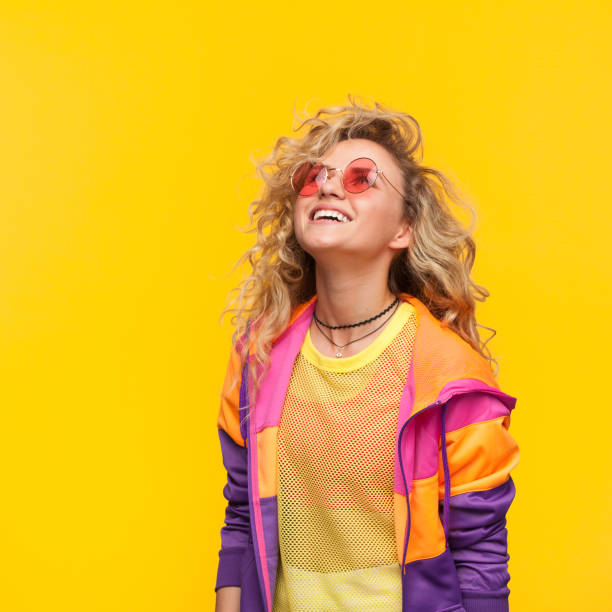 istock Smiling girl wearing sunglasses looking up 809812346