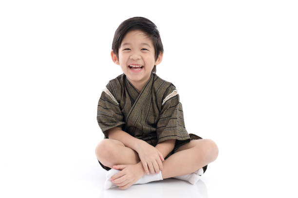 istock Happy asian boy in kimono sitting 809817442