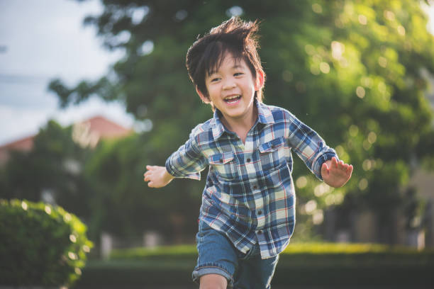 istock Asian child playing pilot aviator in the park 809822266
