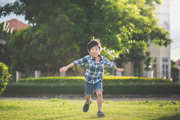 istock Asian child playing pilot aviator in the park 809822284