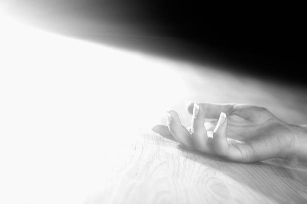 istock Dead or unconcscious woman's hand on floor 809822336