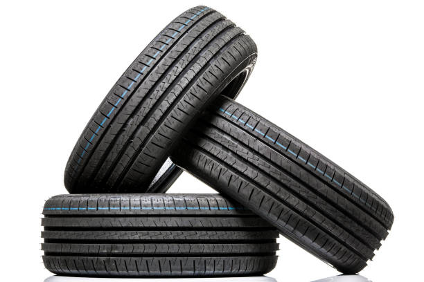istock Stack of brand new high performance car tires on clean high-key white studio background 809822380
