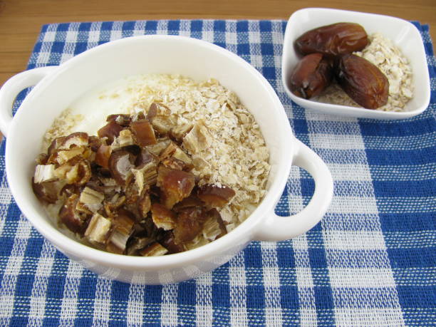 istock Natural yogurt with rolled oats and dates 809822694