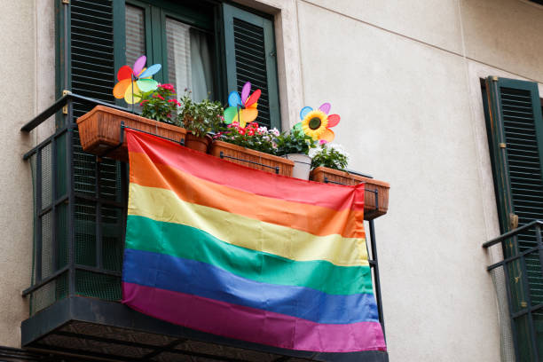 Gay pride balcony Rainbow banners decorating the streets during gay pride party populism stock pictures, royalty-free photos & images