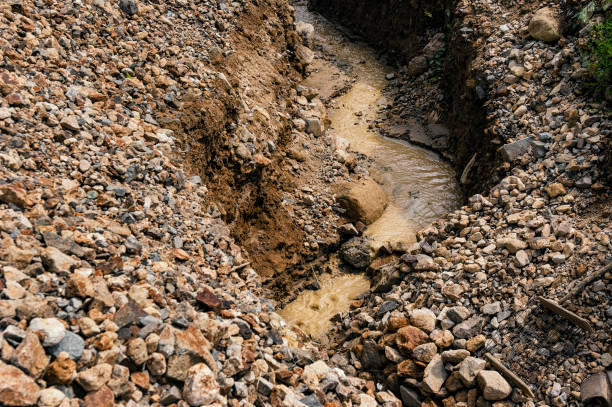 Gold Mine Tailings Deep canal made by small time gold miners gold mining panning stock pictures, royalty-free photos & images