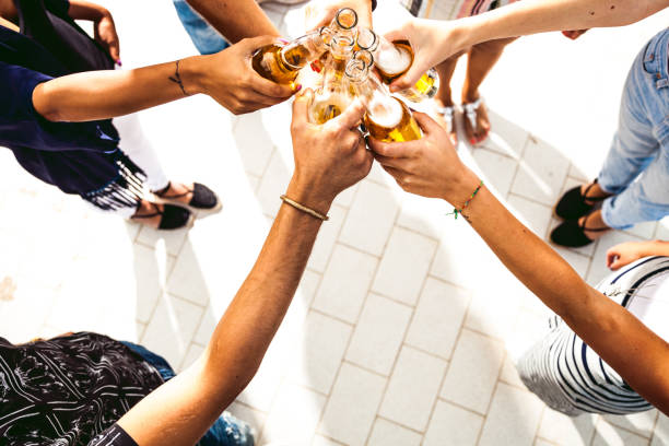 istock Friends having fun and drinking beer at birthday party 809852932
