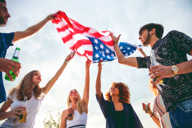 istock Friends celebrating with US flag 809852980