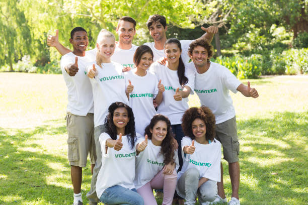 istock Confident volunteers raising thumbs up 809853616