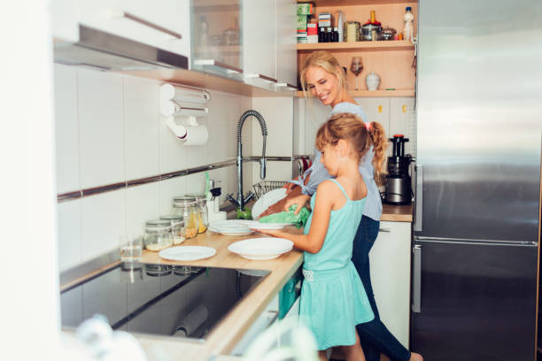istock Mother and Daughter in the Kitchen 809856964