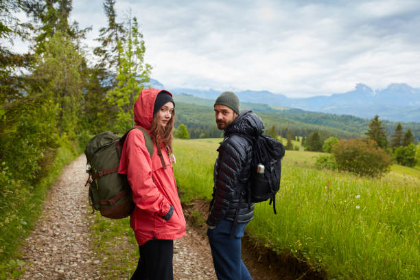 istock Young couple on a trail in the mountains 809859698