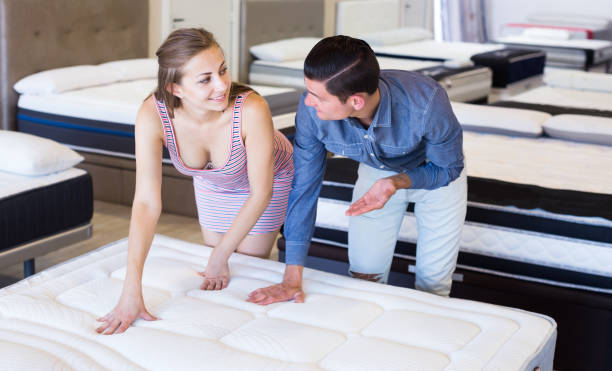 istock Couple choosing mattresses 809860286